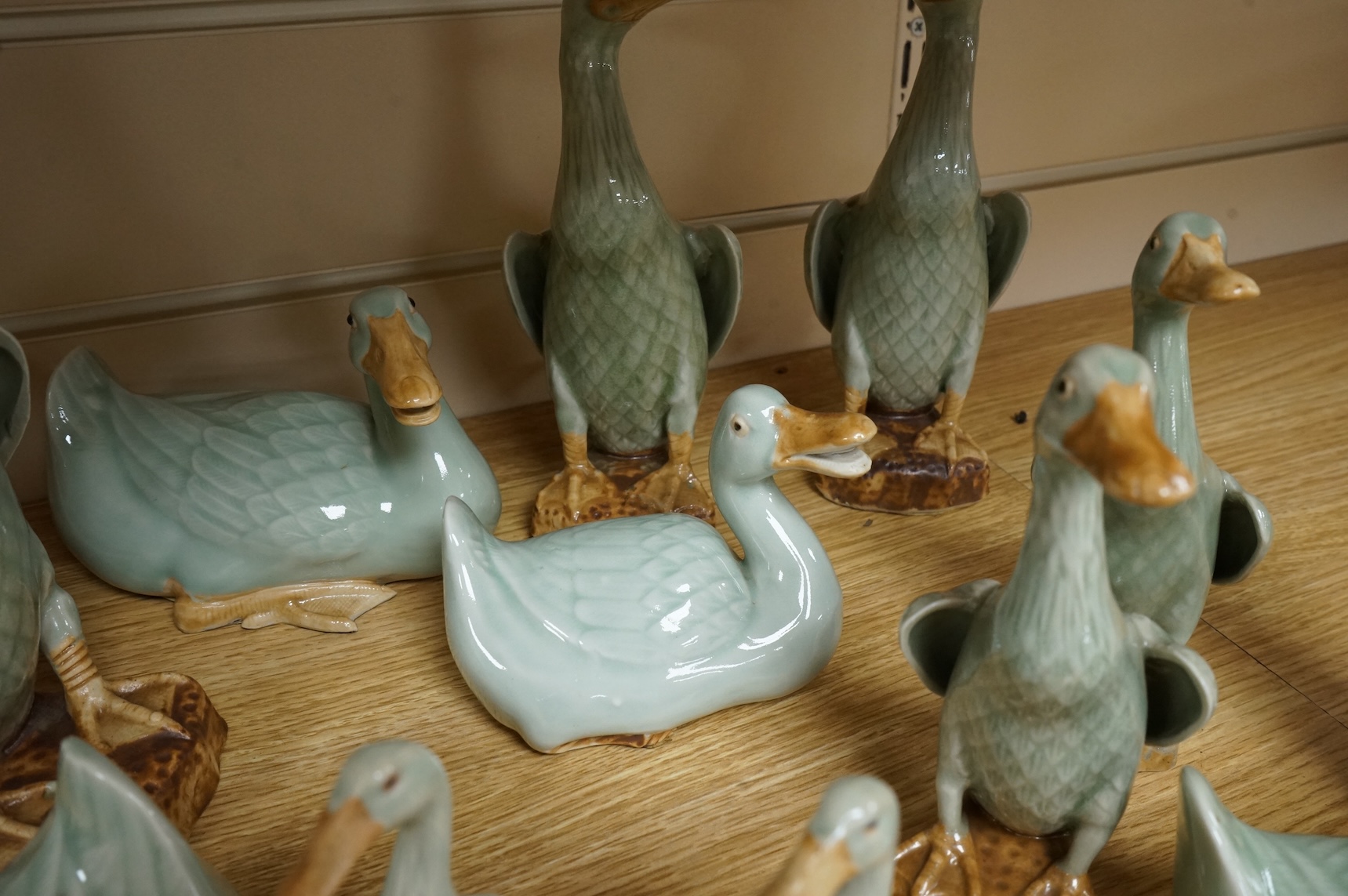 A collection of Chinese celadon glazed models of geese and ducks, largest 31cm high